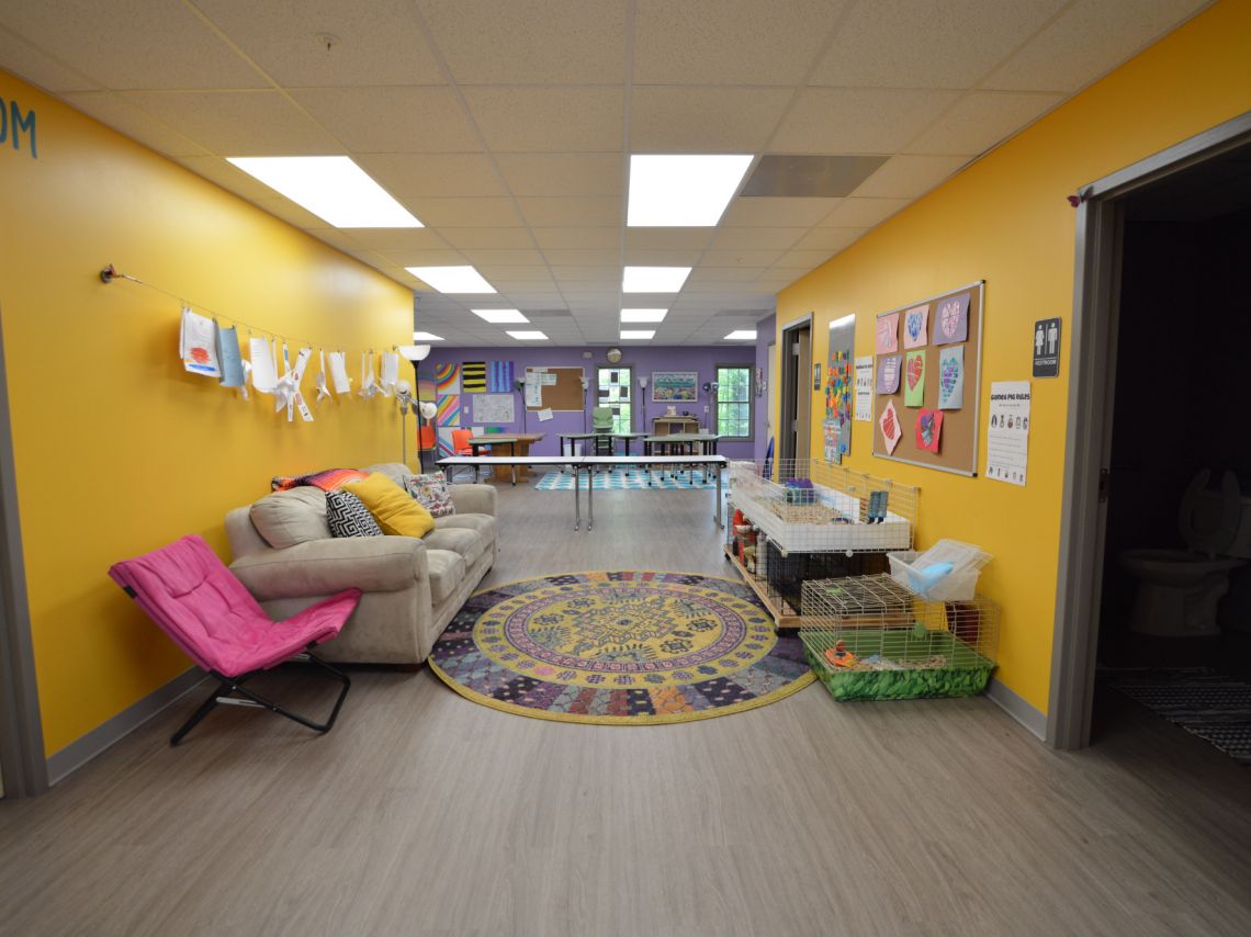 Core Community School Classroom, bright yellow hallway