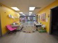 Core Community School Classroom, bright yellow hallway